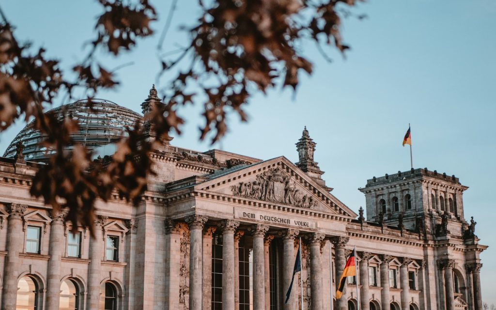 The Reichstag building in Berlin under a blue sky