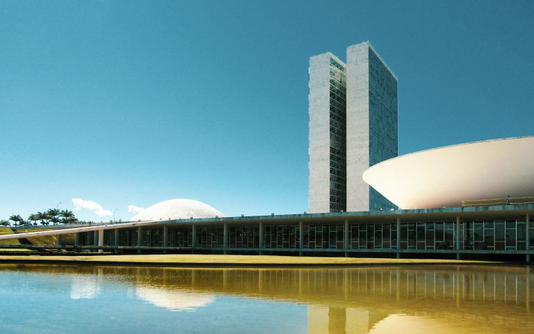Modernist government building beside a reflecting pool in Brasília