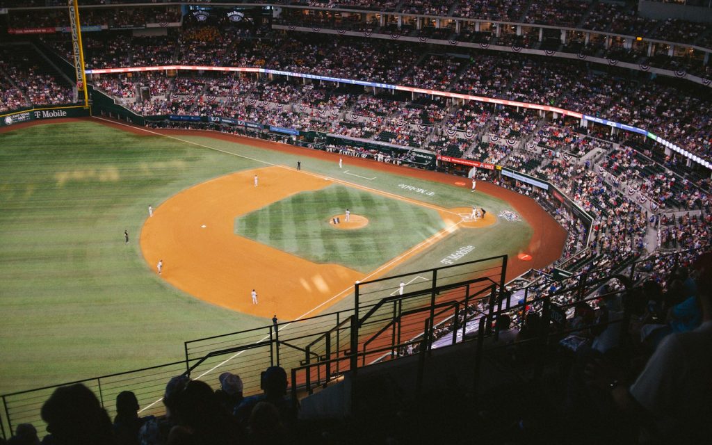 A baseball stadium at night with a game in progress