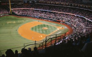 A baseball stadium at night with a game in progress