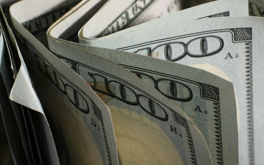 Close-up of US hundred-dollar bills fanned out
