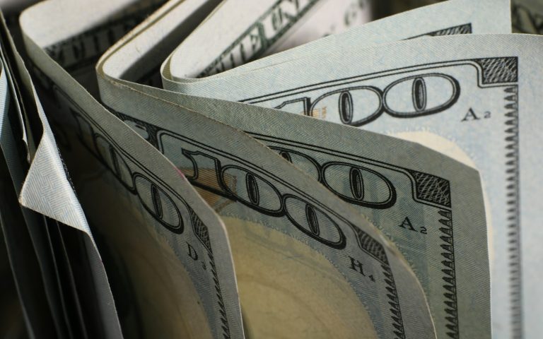 Close-up of US hundred-dollar bills fanned out