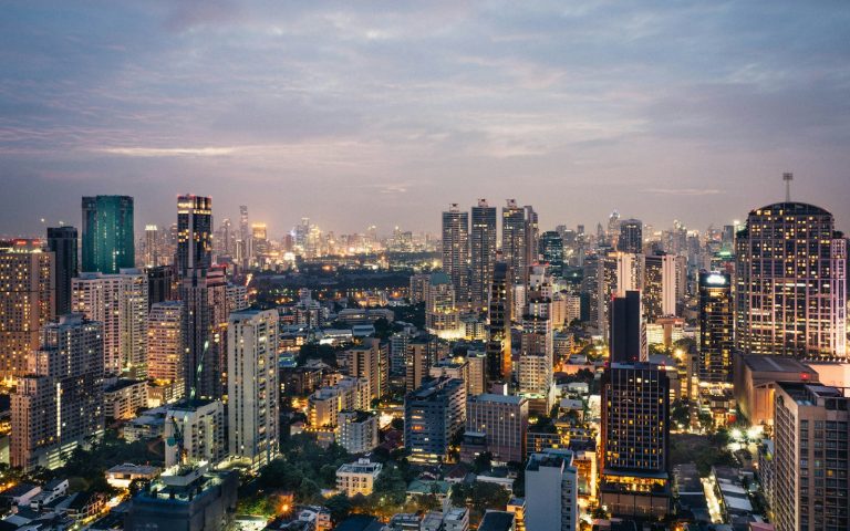 Bangkok skyline at twilight with illuminated skyscrapers