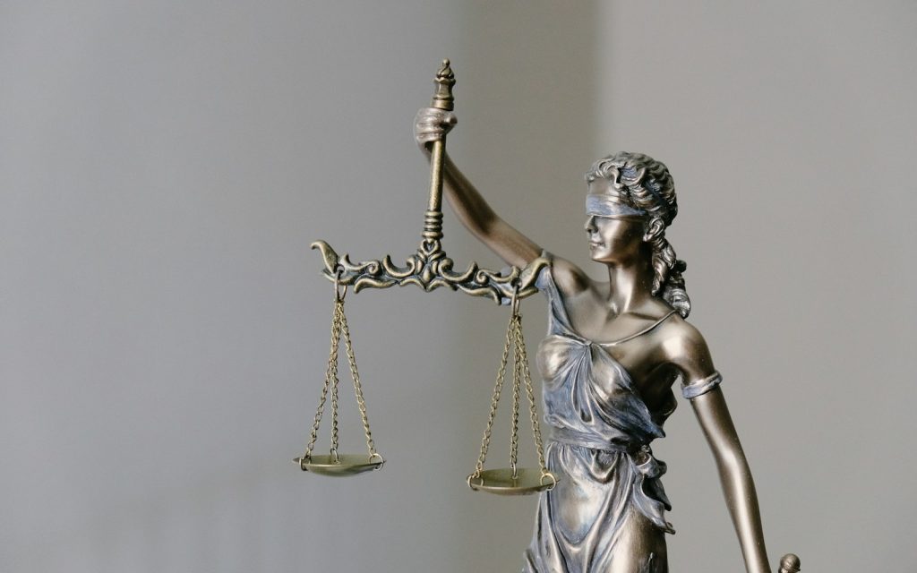 Statue of Lady Justice holding scales and a sword