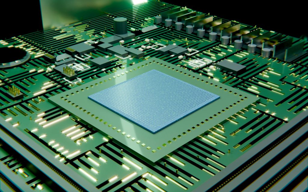 A green circuit board with a central microchip