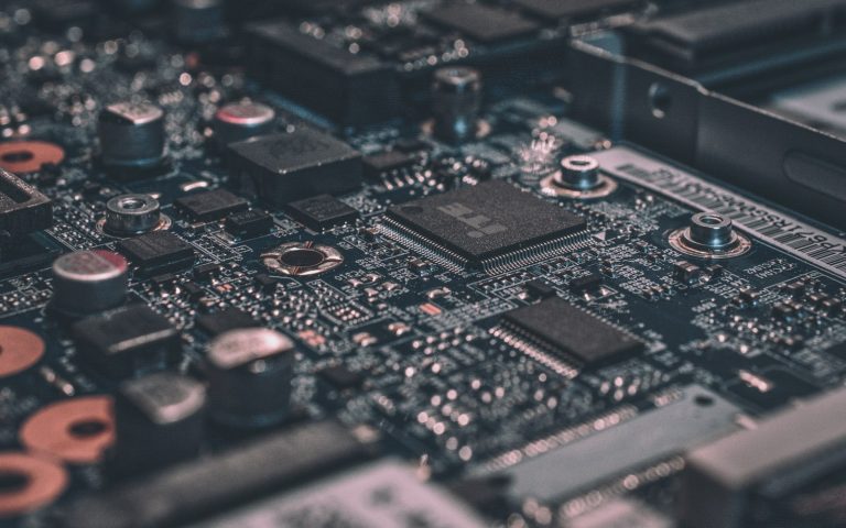 Macro photograph of a dark circuit board